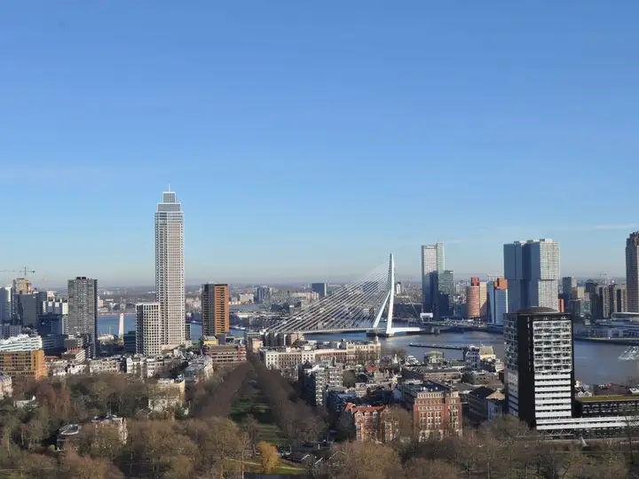 The Rotterdam skyline seen from above, with the Erasmus Bridge crossing the river